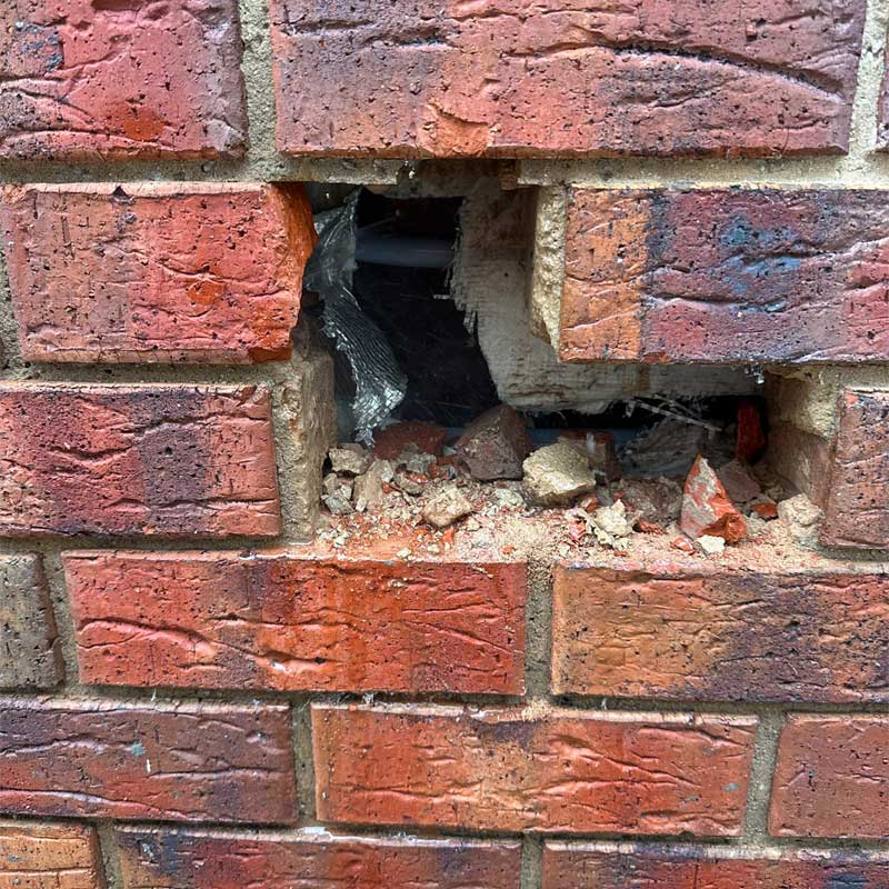 burst water pipe behind wall